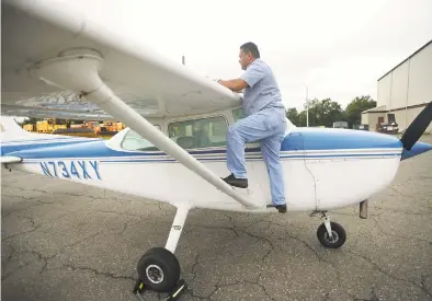  ?? Brian A. Pounds / Hearst Connecticu­t Media ?? Raj Persaud, president of Oxford Flight Training, does an inspection of a Cessna 172 single engine aircraft, used as a primary training plane for student pilots, at Waterbury- Oxford Airport on Thursday.