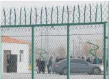  ?? Photo / AP ?? People line up at the Artux City Vocational Skills Education Training Service Centre at the Kunshan Industrial Park in Artux in western China’s Xinjiang region.