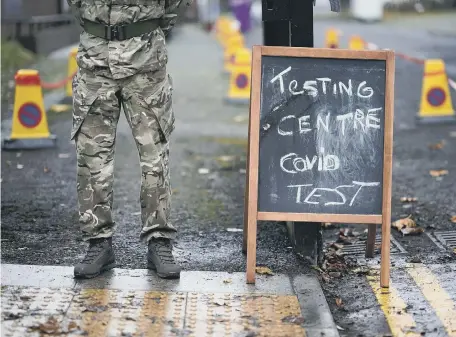  ??  ?? Soldiers from the 1st battalion Coldstream Guards helped run the testing scheme in Liverpool. Below, Cllr Graeme Miller.