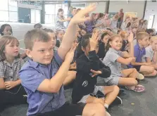  ?? Picture: ALISON WILLIAMS ?? Tyler Pitts, Lilia Amamoto and Grace Rozendaal joining in with the actions for the Gindarja (cassowary) dance