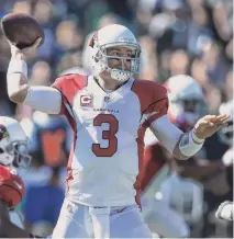  ?? AP ?? Cardinals quarterbac­k Carson Palmer has handled the blitz better this season, thanks in large part to a reinforced offensive line.