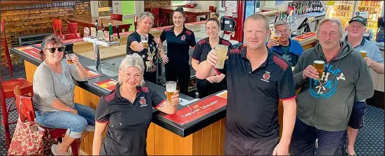  ??  ?? Burkes Hotel Yarrawonga owner Andrew Curran (centre) pictured at the December reopening, is glad to be open again but tight restrictio­ns this time have made trading difficult.