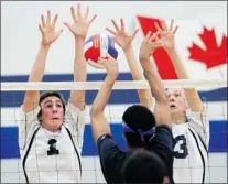  ??  ?? JASON KRYK/The Windsor Star Holy Names’ Andrew Wasyluk, left, and Philip Sax, block a spike from Massey’s Alexander Vukovic during WECSSAA volleyball
Thursday. The Knights defeated the Mustangs 3-0.