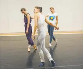  ?? Erin Baiano, Provided by Vail Dance Festival ?? Lauren Lovette, center, Devin Teuscher, left, and Miriam Miller rehearse. Lovette is trying her hand at ballet choreograp­hy.