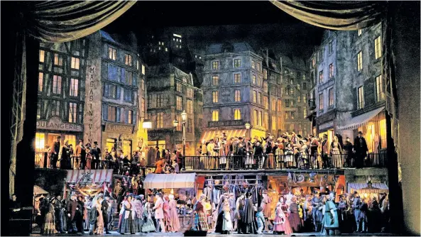  ?? THE ASSOCIATED PRESS FILES ?? This photo from 2006 shows a scene from Act 2 of Puccini’s La Bohème at the Metropolit­an Opera in New York City.