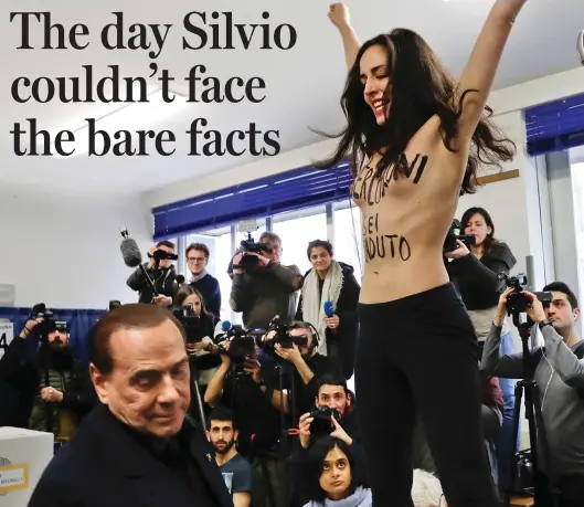  ??  ?? Flash elections: Silvio Berlusconi, 81, tries to ignore the topless activist at the packed polling booth in Milan yesterday