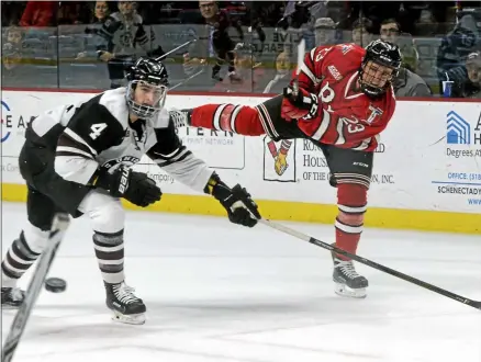  ?? THE ASSOCIATED PRESS ?? RPI’S Lou Nanne (23) takes a shot as Union’s Nick DeSimone defends in the Mayor’s Cup NCAA ice hockey game Thursday, Jan. 19, 2017 at