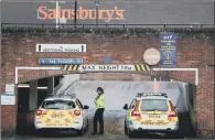  ?? PICTURES: PA WIRE. ?? INQUIRY SPREADS: Police block the entrance to Sainsbury’s car park in Salisbury in Wiltshire nas part of the poisoning inquiry.