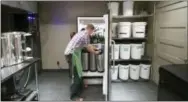  ?? KAL WALLNER — THEELECTRI­CBEWERY.COM VIA AP ?? This 2013 photo provided by Kal Wallner, shows Wallner pulling a keg of beer from a refrigerat­or in his home brewery room in Ottawa, Canada. Wallner is an electrical engineer who designed a brewing system for himself that he now sells online at...