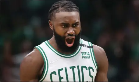  ?? ?? YEAH, THAT HOT: Celtics guard Jaylen Brown roars during Sunday’s decisive Game 7 against the Bucks at TD Garden.