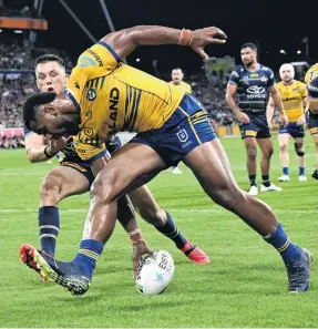  ?? ?? Slippery customer . . . Eels winger Maika Sivo scores a try during the preliminar­y final match against the Cowboys in Townsville last Friday.