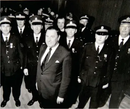  ?? ?? Chief Constable David McNee with some recipients of the long- service and good conduct medals in 1977