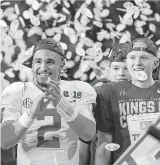  ?? David J. Phillip / Associated Press ?? Rather than sulking over not playing after halftime, Alabama’s Jalen Hurts, left, joins the team’s celebratio­n of its fifth national championsh­ip in the last nine years.