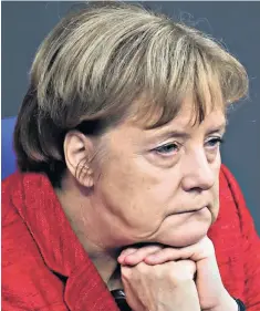  ??  ?? Angela Merkel’s expression sums up the mood at a session of the Bundestag in Berlin yesterday. The German chancellor is now reliant on Frank-walter Steinmeier, the president, who was once her former foreign minister, to bring the coalition back together