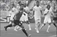  ?? The Associated Press ?? TO THE NEXT LEVEL: Uruguay’s Luis Suarez celebrates scoring his side’s first goal during the Group A match against Saudi Arabia at the 2018 World Cup in Rostov Arena in Rostov-on-Don, Russia, Wednesday.