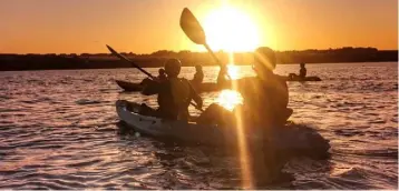  ??  ?? The group enjoy calm conditions and a beautiful sunset.