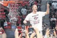  ?? HAYNE PALMOUR IV TRIBUNE NEWS SERVICE FILE PHOTO ?? Toronto’s top pick, Malachi Flynn, cuts the net after San Diego State’s victory over New Mexico in February.