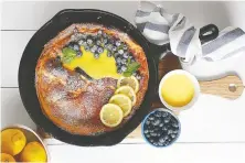  ??  ?? Add a sweet touch to the day with a Lemon Blueberry Dutch Baby Pancake.
