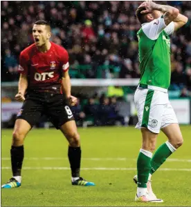  ??  ?? BLOWN IT: Hibs’ Swanson can’t believe he has missed, much to Dicker’s delight