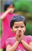  ?? AFP ?? A child whistling her name. In this matrilinea­l society, property is passed down from mother to daughter, while a husband moves in with his wife and takes her name.