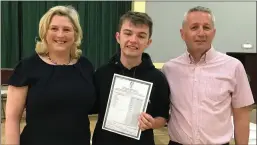  ??  ?? Right: Conor Myers with Mary Jackson, Principal and Tony Corcoran, Deputy Principal