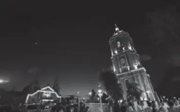  ?? (Arnold Almacen/City Mayors Office/PNA photo) ?? The newly-restored Jaro belfry (right) was formally turned over by the National Historical Commission of the Philippine­s to the Iloilo City government and the Archdioces­e of Jaro in a ceremony on Sunday night, November 27. The ringing of its carillon bells was again heard by Ilonggos after 74 years.