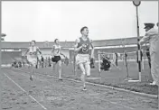 ?? Associated Press ?? ELITE COMPANY Laszlo Tabori breaks the four-minute barrier in the mile in London in 1955, the third person to do so.
