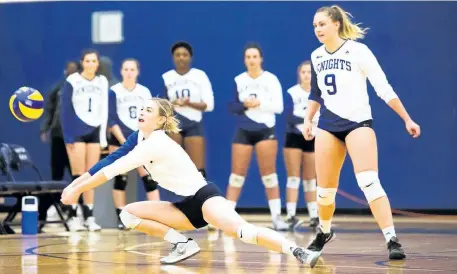  ?? RYAN MCCULLOUGH PHOTO COURTESY NIAGARA COLLEGE ?? Jordan Kozlowski, foreground, shown bumping the ball in this file photo, is the first player in the history of the Niagara College women's volleyball program to be named an all-Canadian.