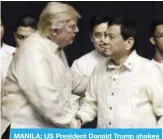  ??  ?? MANILA: US President Donald Trump shakes hands with Philippine­s President Rodrigo Duterte during a gala dinner marking ASEAN’s 50th anniversar­y yesterday.