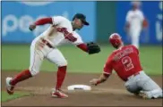  ?? TONY DEJAK — ASSOCIATED PRESS ?? Francisco Lindor cannot make the tag as the Angels’ Andrelton Simmons slides safely into second base.