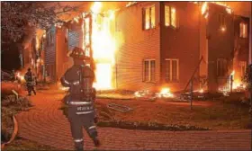  ?? PETE BANNAN – DIGITAL FIRST MEDIA ?? Firefighte­rs battle a blaze at the Barclay Friends Home in West Chester late at night on Nov. 16. Four people died and nearly 30 were injured.