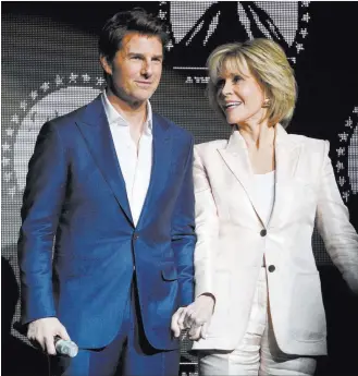  ?? Chris Pizzello ?? The Associated Press Tom Cruise, star of “Mission: Impossible — Fallout,” joins hands onstage Wednesday with Jane Fonda, a cast member in “Book Club,” at Cinemacon 2018 at Caesars Palace.