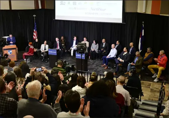  ?? ANDY CROSS — THE DENVER POST ?? Sixteen candidates sit on stage for the Fair Elections Fund Mayoral debate in Claver Hall at Regis University on Feb. 9.