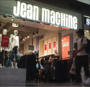  ?? CP PHOTO ?? A Jean Machine storefront is shown in Toronto on Wednesday. Four months after acquiring Jean Machine, the new owner of the denim retailer says it plans on “cleaning up” the look of its stores as part of an effort to woo back customers.