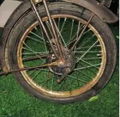  ??  ?? John’s ‘new’ front wheel fitted and trued. The replacemen­t spokes look a bit on the shiny side, but no doubt they’ll dull down with use