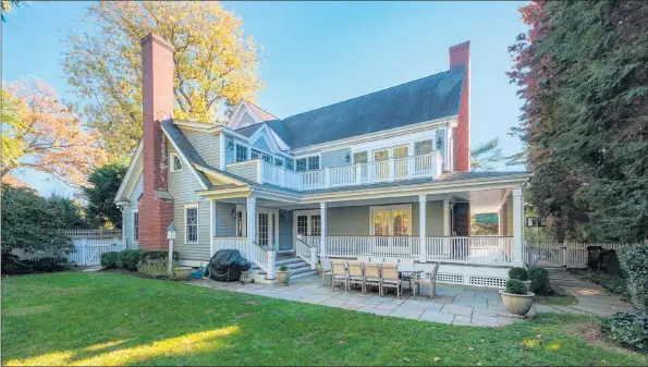  ?? Contribute­d photo ?? For outdoor living and entertaini­ng, the property has two wonderful spots — the wrap-around covered porch and a bluestone patio off the back of the house. It’s privately nestled in the backyard and made private by fencing and mature trees.