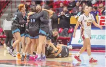  ?? JON AUSTRIA / JOURNAL ?? Navajo Prep players celebrate after beating Tohatchi in the Class 3A girls championsh­ip game Friday at the Pit.