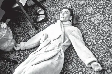  ?? — WP-Bloomberg photos ?? Benanti relaxes and stretches during intermissi­on of the evening performanc­e of ‘My Fair Lady’.