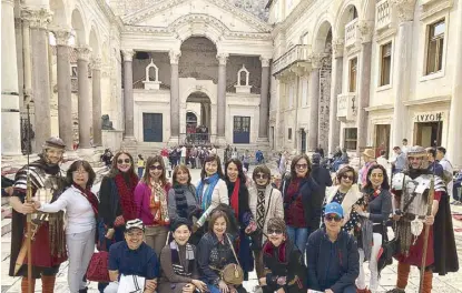  ??  ?? At the Diocletian’s Palace with ‘Roman guards’ are (first row, from left) Julian Morales, Rosky de Guzman, Joy Silva, Brenda Yabyabin and Rene Cinco; (second row, from left) Yette Morales, Shan David, the author, Sonia Banta, Miren Sun, Charlene Sun, Juliet Cinco, Dorothy Cheong, Edna Estolano and Bern Concepcion.