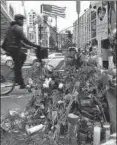  ?? AFP ?? ▪ Flowers mark the location where a man crashed a truck into people walking and cycling along a Manhattan bike path