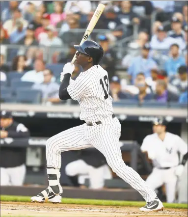  ?? Al Bello / Getty Images ?? The Yankees’ Didi Gregorius hits a solo home run against the Nationals in the second inning of Tuesday’s game at Yankee Stadium in New York.
