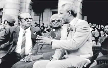  ??  ?? High profiles: Dr Chota Motala speaks at the unveiling of the Gandhi memorial in Pietermari­tzburg in 1993 (top). He is flanked by John Jeffery (left), Harry Gwala and Walter Sisulu. Motala and Archbishop Emeritus Desmond Tutu listen to Nelson Mandela...