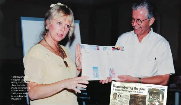  ??  ?? TOTI Media’s first designer, Dana Nicloy, and Friedrich show the initial media kit for Times
of the Islands at a 1996 presentati­on to introduce the magazine.