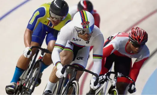  ??  ?? Taking it up a level: National cyclist Azizulhasn­i Awang (front) in action during the KL SEA Games keirin race at the National Velodrome in Nilai last month.