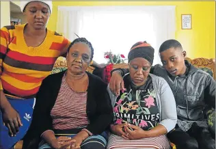  ?? PICTURE: RANDELL ROSKRUGE ?? GRIEF-STRICKEN: The Roberts family is in shock over the way their little boy Mpho, 6, top right, lost his life in his brother Romeo's arms on Tuesday morning at Empilweni Clinic in Gompo. Pictured are Mpho’s aunt Jeanie, Johanna, Mpho’s mother Marilyn,...