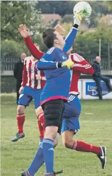  ??  ?? Whitby RUFC’s keeper punches the ball to safety