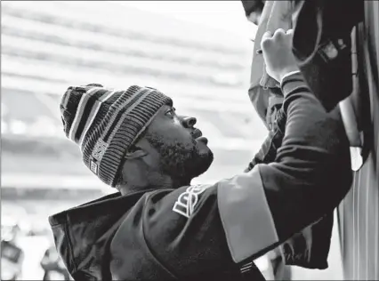  ?? BRIAN CASSELLA/CHICAGO TRIBUNE ?? Allen Robinson, the Bears’ nominee for the Walter Payton NFL Man of the Year Award, signs autographs before the Giants game Nov. 24.