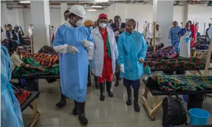  ?? ?? The Zambian president, Hakainde Hichilema, visiting a cholera treatment centre last year. He urged people move out of towns and into rural areas. Photograph: Zambia President Office