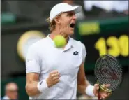  ?? GLYN KIRK — THE ASSOCIATED PRESS ?? Kevin Anderson of South Africa celebrates winning a point from John Isner of the US during their men’s singles semifinal match at the Wimbledon Tennis Championsh­ips, in London, Friday.