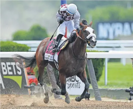  ?? BRAD PENNER/ USA TODAY SPORTS ?? Jockey Manuel Franco pumps his fist after winning the 152nd running of the Belmont Stakes aboard Tiz the Law.